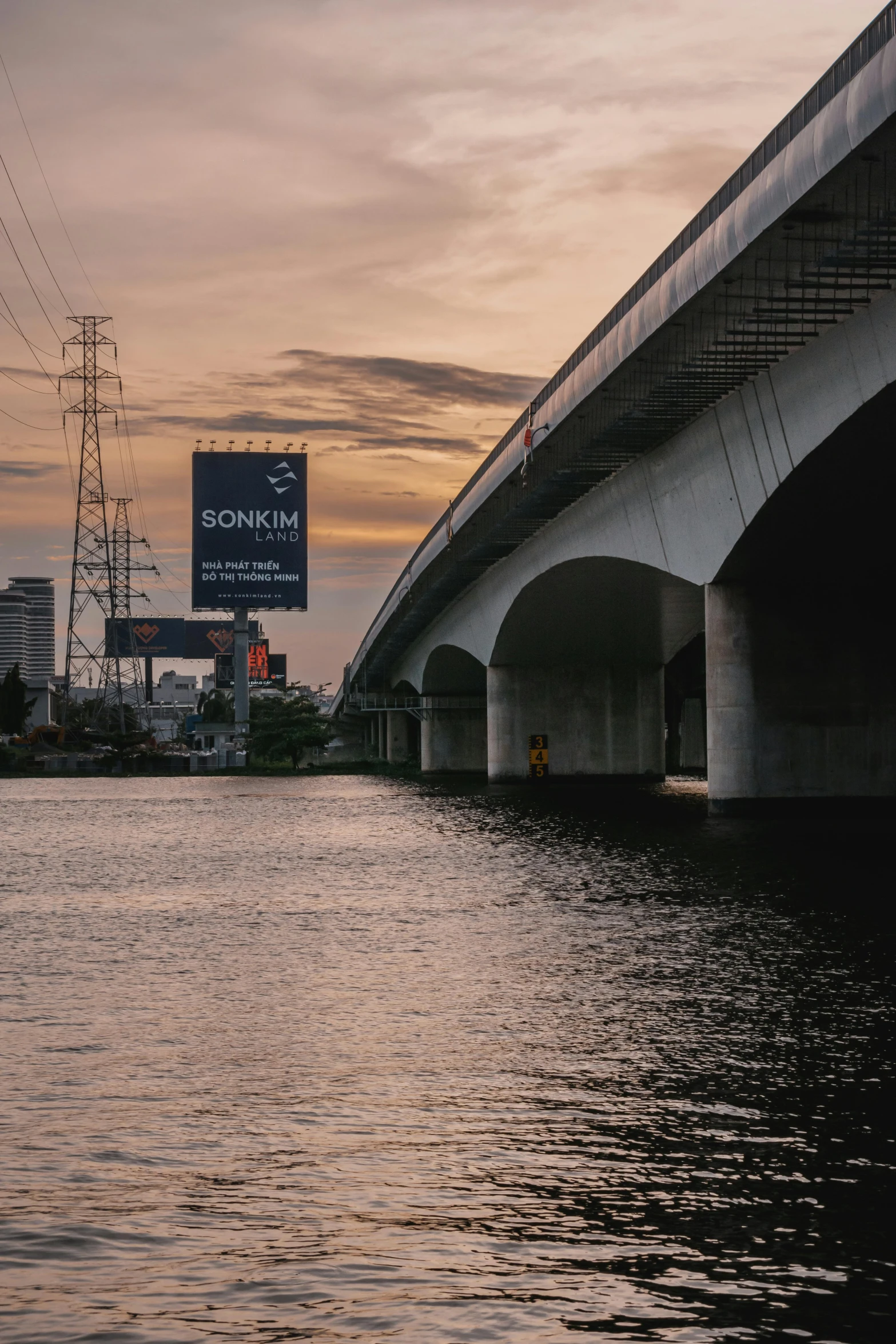 an underpass on a bridge with a road sign