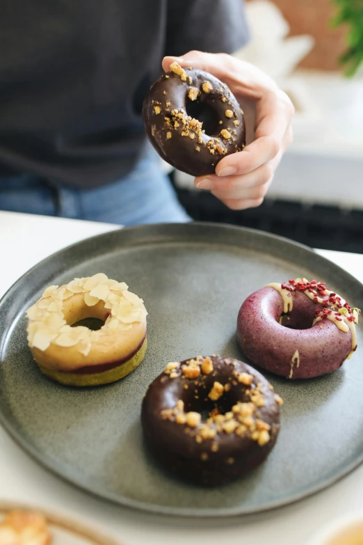 this is a tray that has three donuts on it