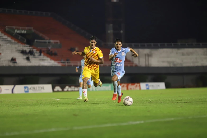 a group of soccer players are in the field