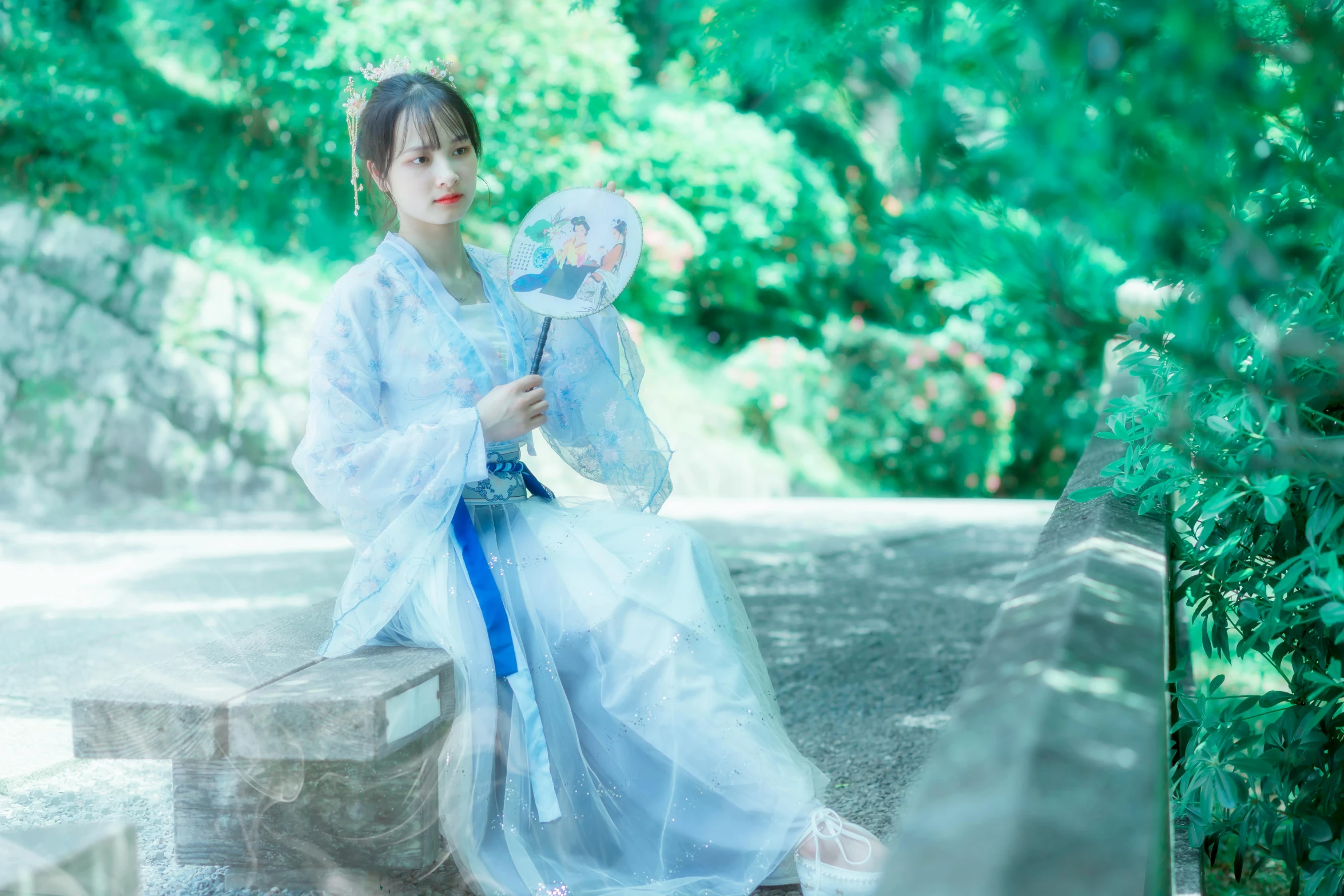 a woman in white holding a plastic ball