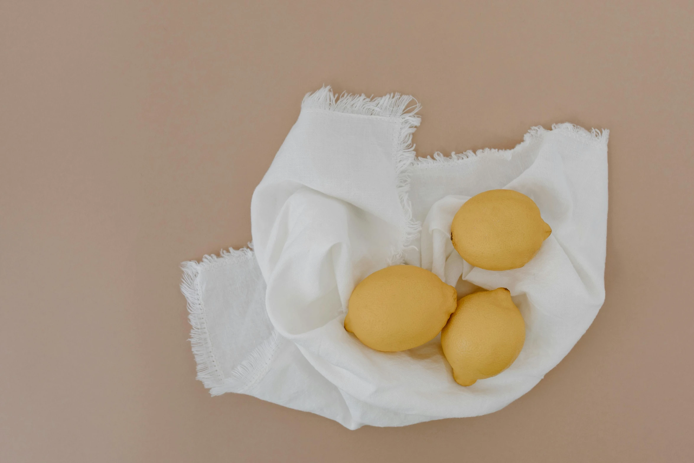 four cookies on top of a napkin on a table