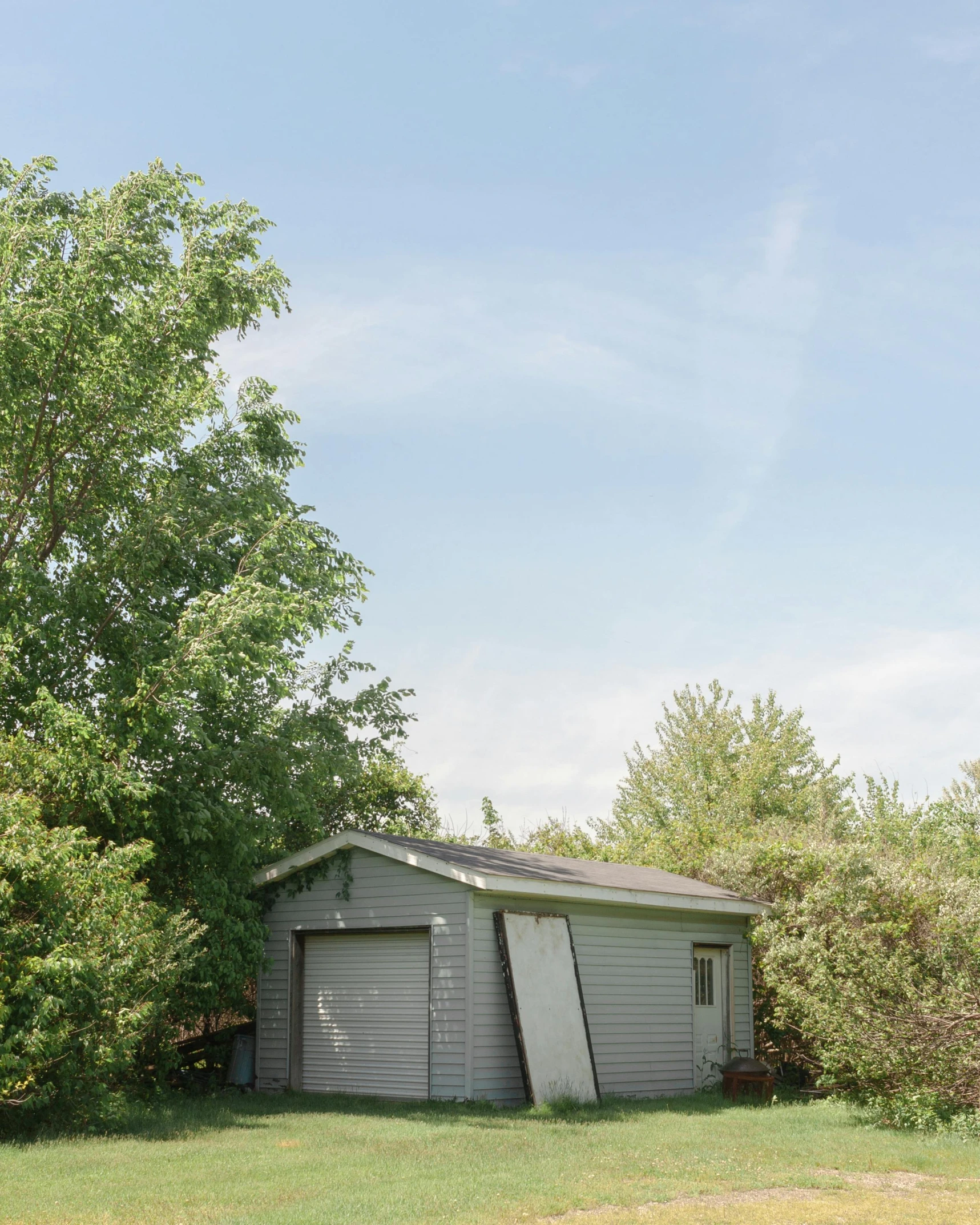 a garage with a large piece of equipment between it