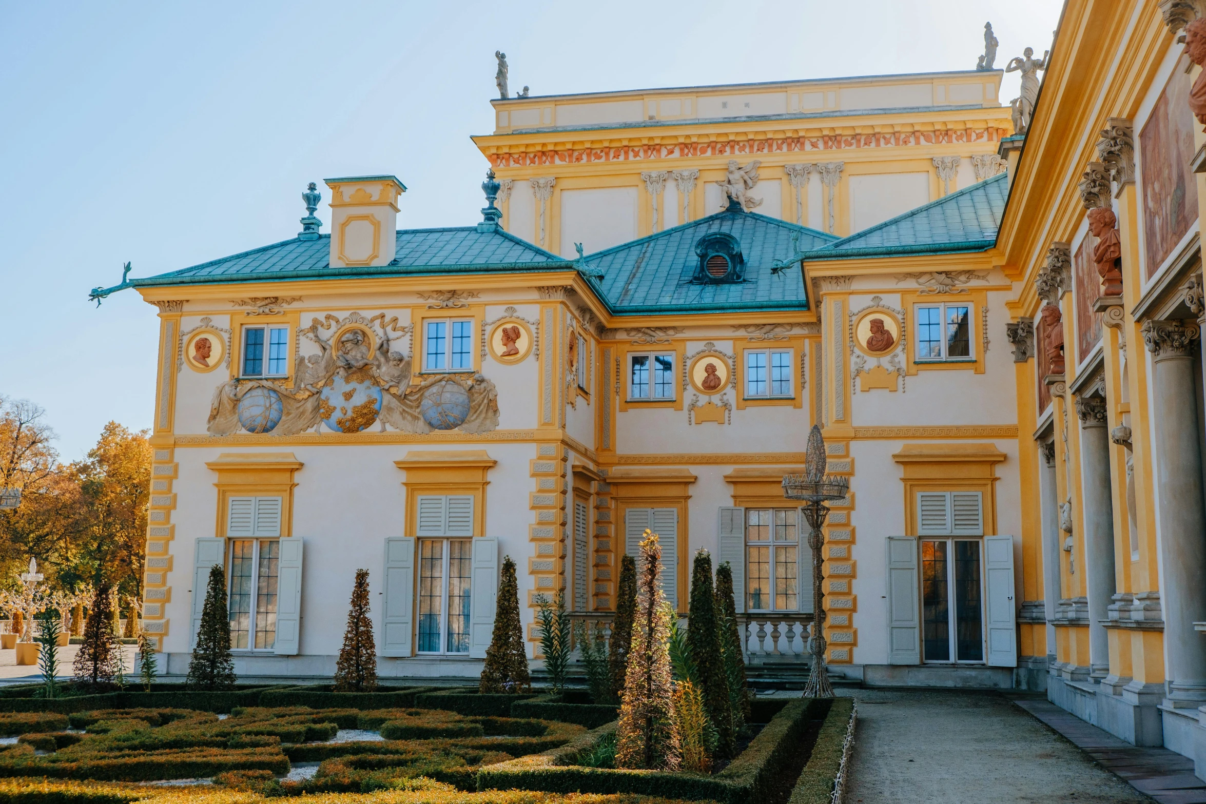 a very old and nice yellow house with blue roof