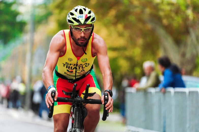 man on a bicycle wearing a jersey and helmet