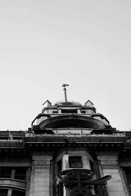 a large building with an ornate roof and weather vane