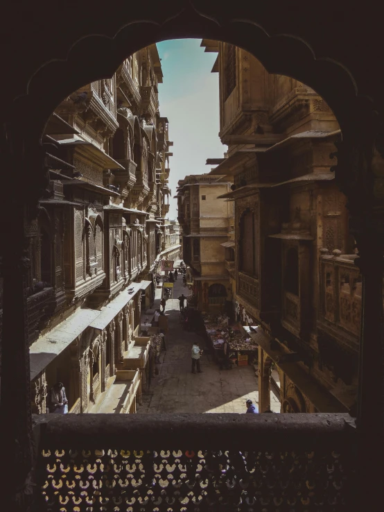 a cityscape with an arched doorway and street signs