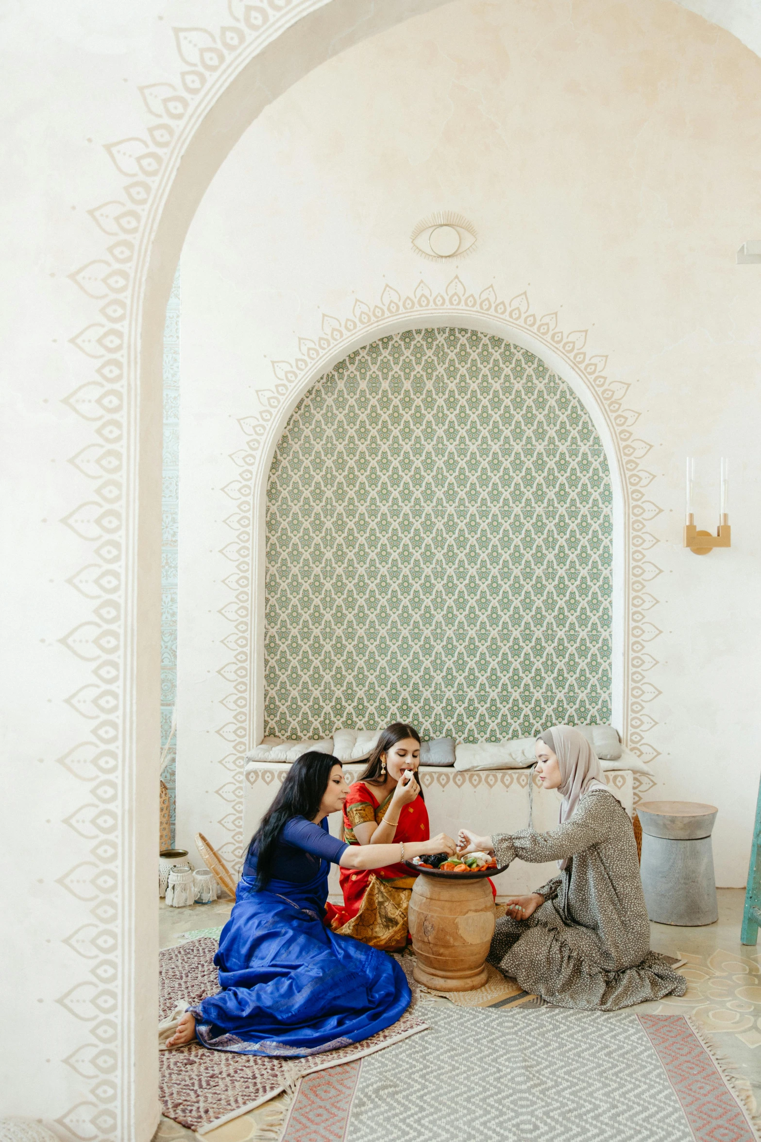 two women are sharing tea in their very fancy kitchen