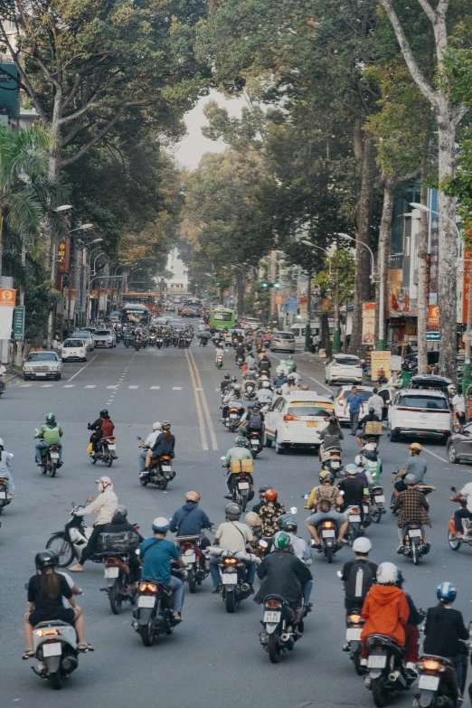 a street filled with motorcycles and cars on it
