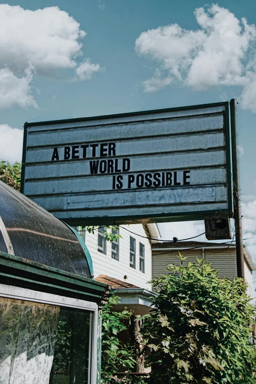 a sign advertising an outside restaurant sitting in the sun