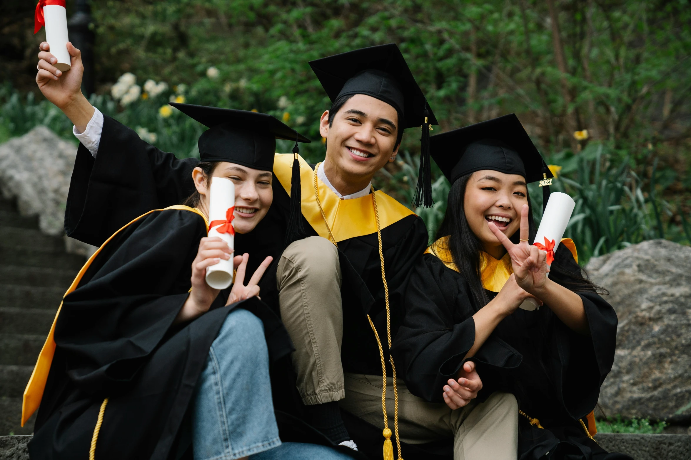 a group of students that are wearing graduation robes