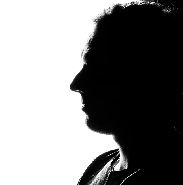 a close up of a person in silhouette against a white background