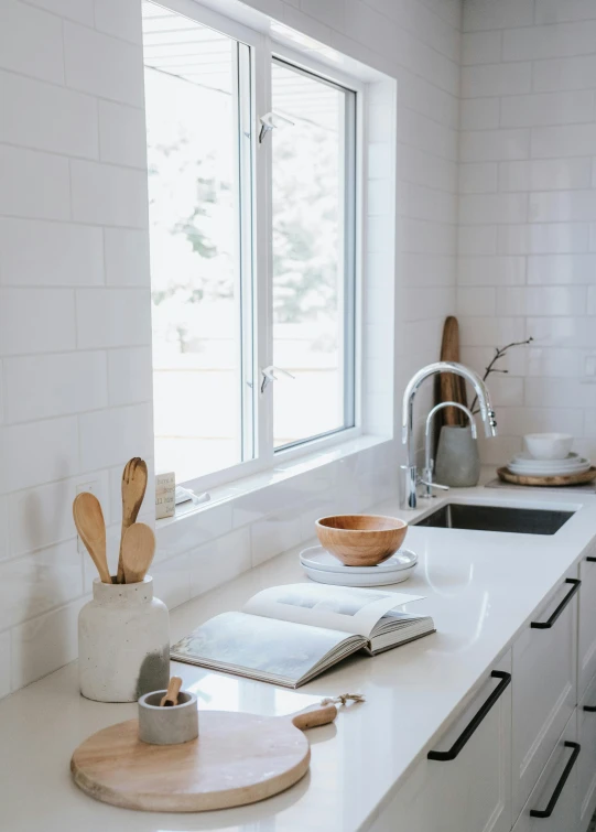 a kitchen counter with various utensils and utensils on it