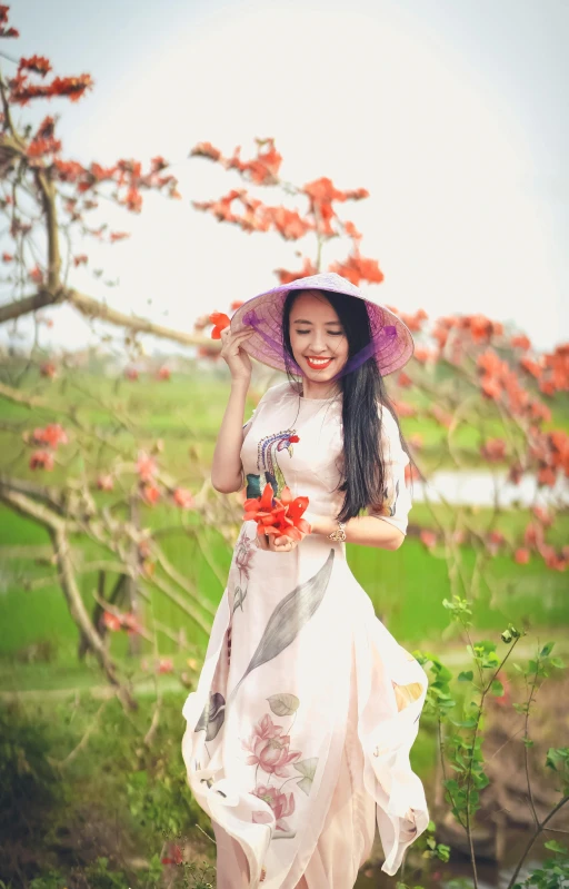 an asian woman holding a purple umbrella and flowers