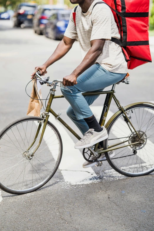 a man riding a bicycle down the street