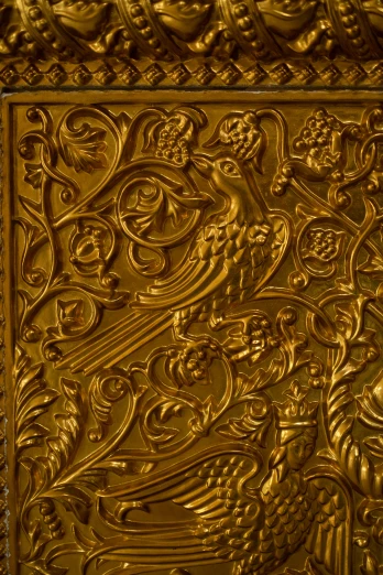 a gold plate is decorated with a decorative design