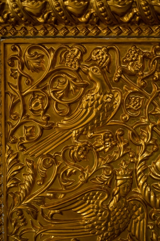 a gold plate is decorated with a decorative design