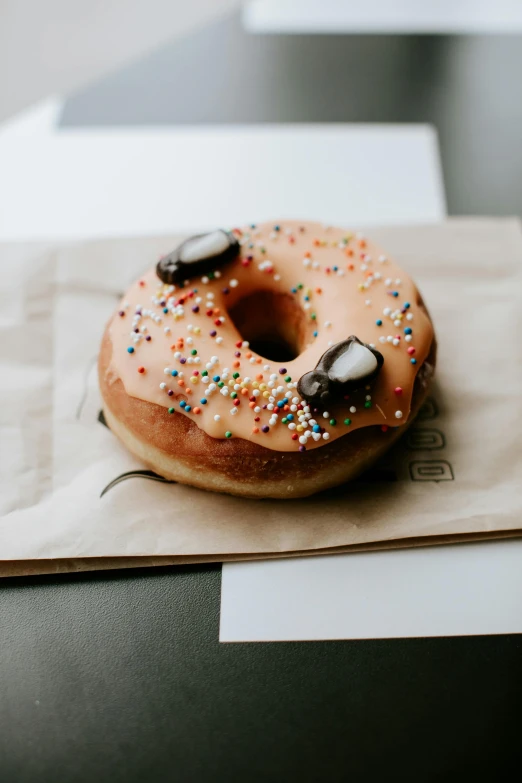 a donut with marshmallows is on paper