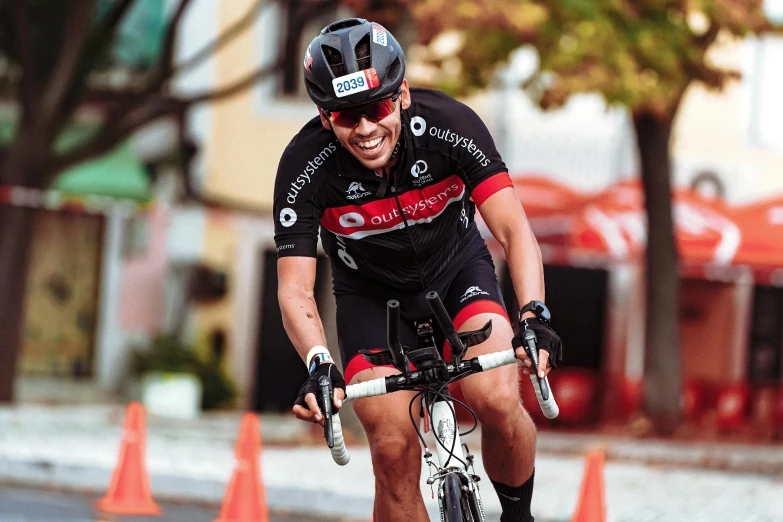 a man riding a bike through a road