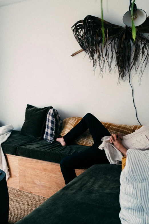 a person laying on a couch in a room