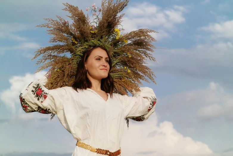 there is a woman in white and flowery head gear