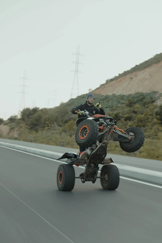 a person riding an atv with a motorbike