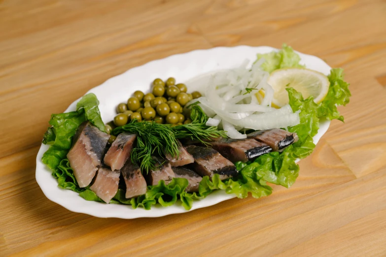 a plate of food on a table with a fork and knife