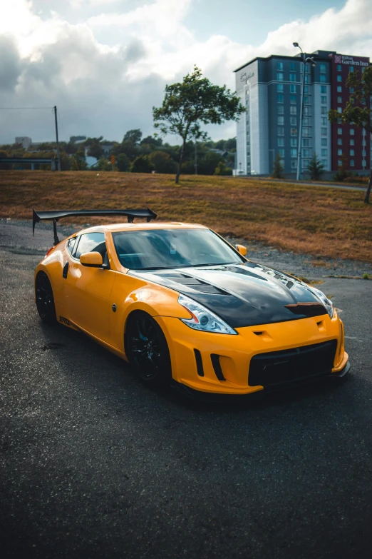 a black and yellow car parked on a driveway