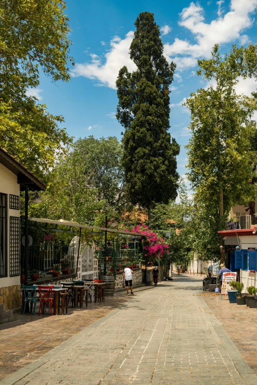 there are tables and chairs on the street