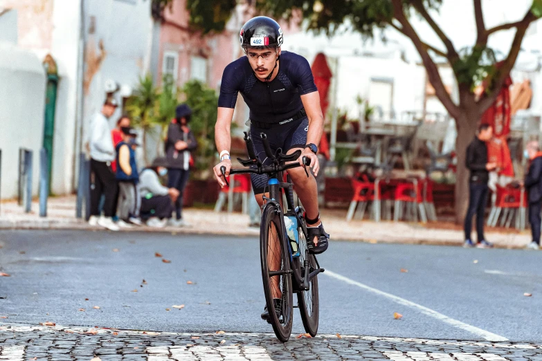 a man riding a bike while wearing a bib