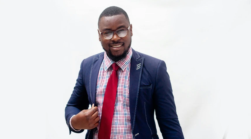 a man in a blue jacket and red tie