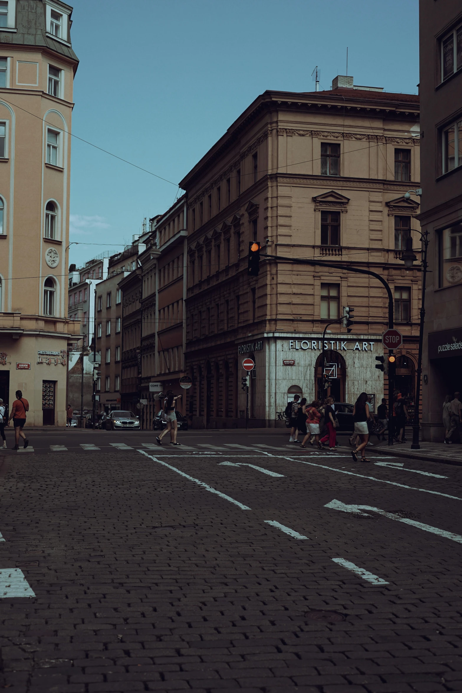 the view of an empty city street, at dusk