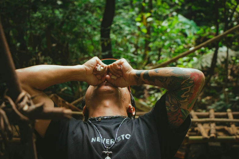 the man is looking through his glasses in the forest