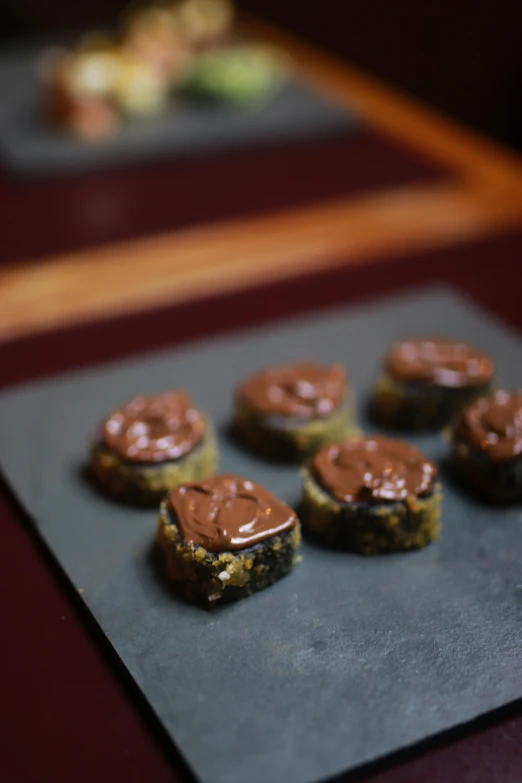 cookies with chocolate frosting on a counter