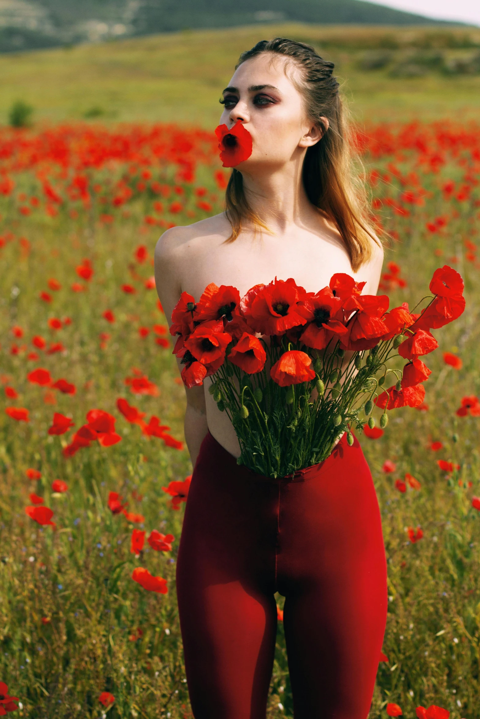 a woman wearing red underwear holding flowers with red nose noses