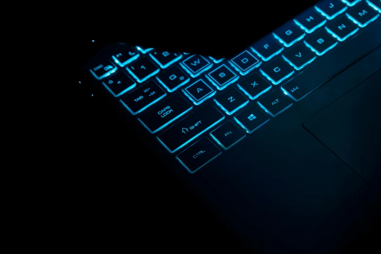 the keyboard is blue and glowing against a black background