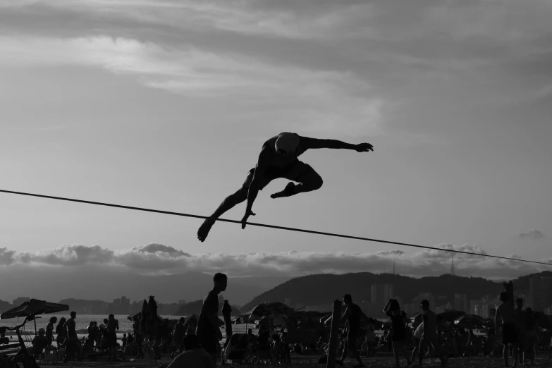 an athlete is performing a high jump on a rope