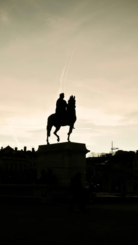 a black and white po of a man riding a horse