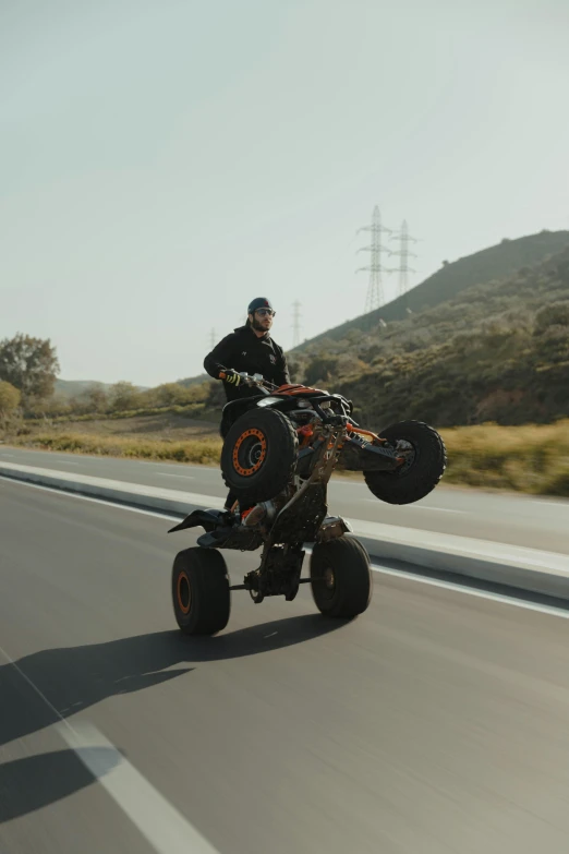 a guy riding an electric car on the highway