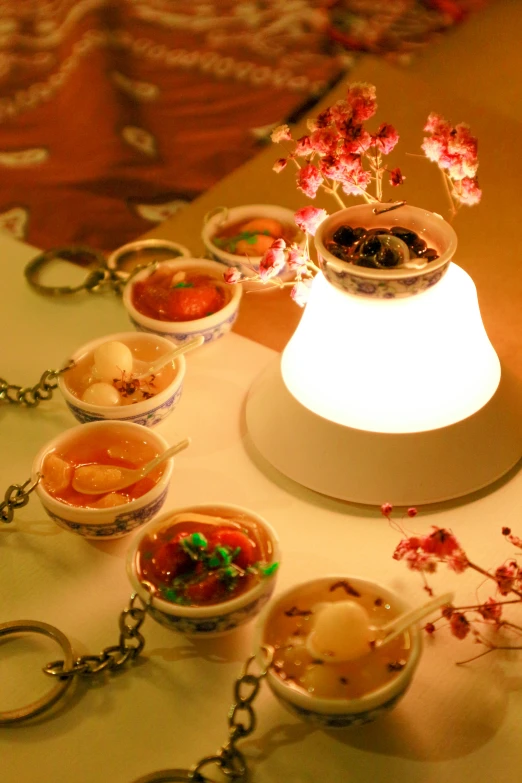 a white table with some food and cups on it