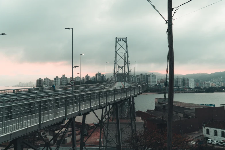 a train traveling over a bridge across a large river