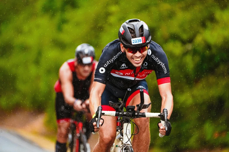 a man riding a bike down a road