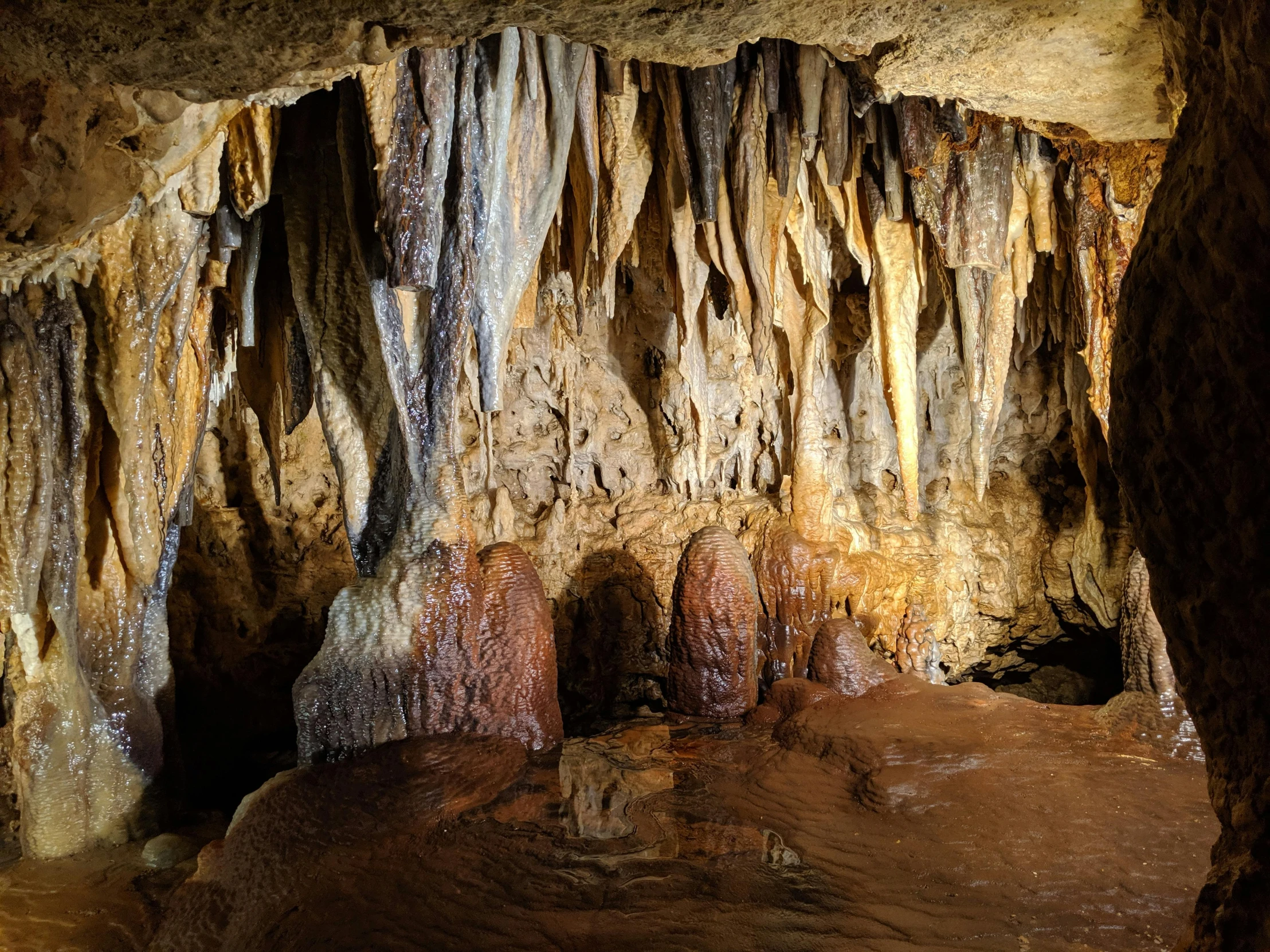 a cave filled with lots of water and rock formations