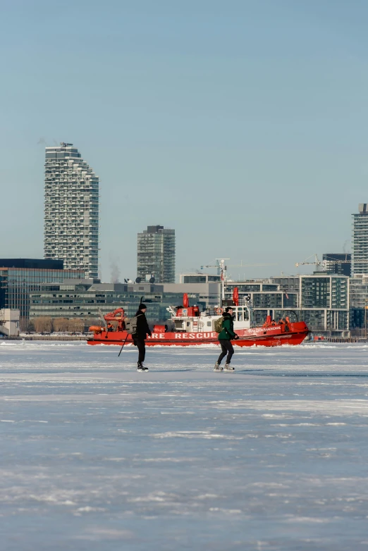 a couple of men are standing in the snow