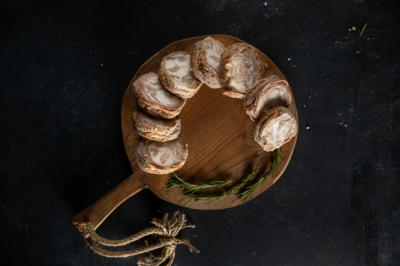 a wooden board with several types of baked goods on it