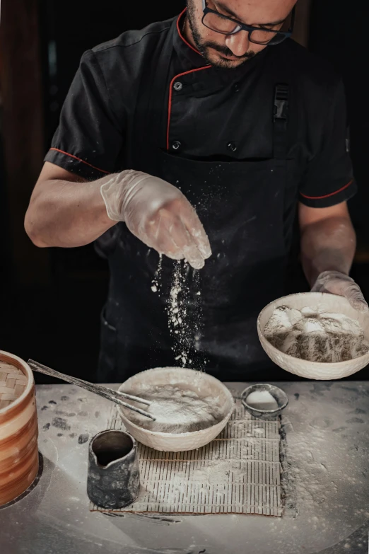 chef in uniform making dishes from a table