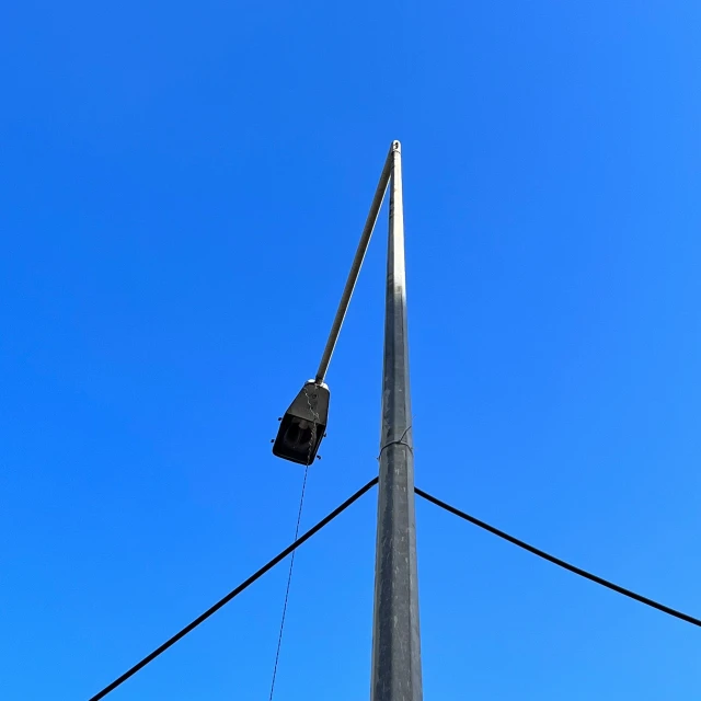 a very tall pole that has a crane on it