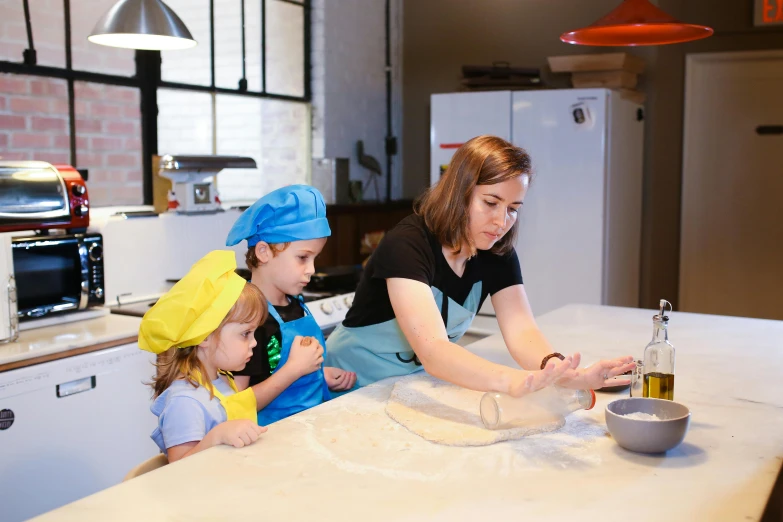 a woman with two children and some flour