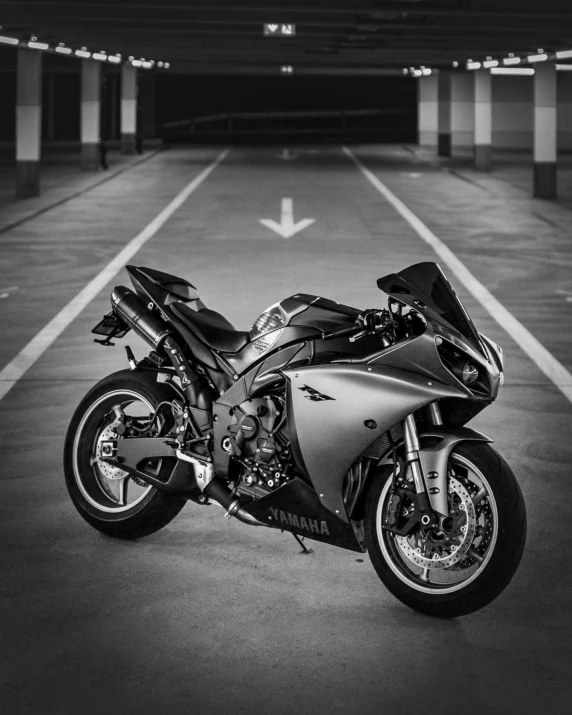 a motorcycle parked in the parking garage while it is being cleaned