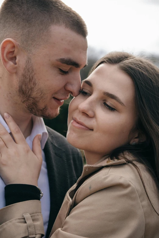 a couple emcing each other and looking into the camera