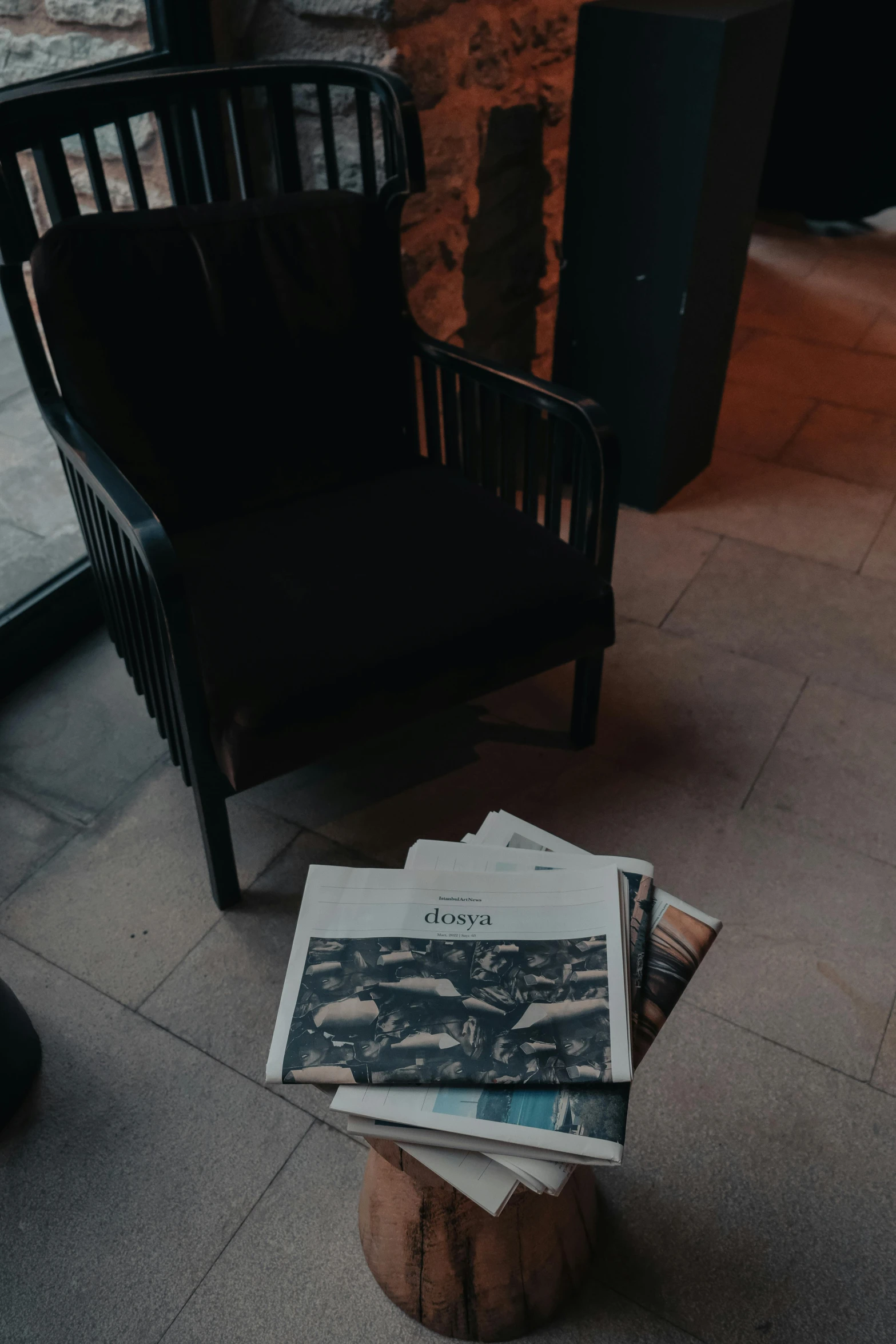 an outdoor seating area with magazines on it